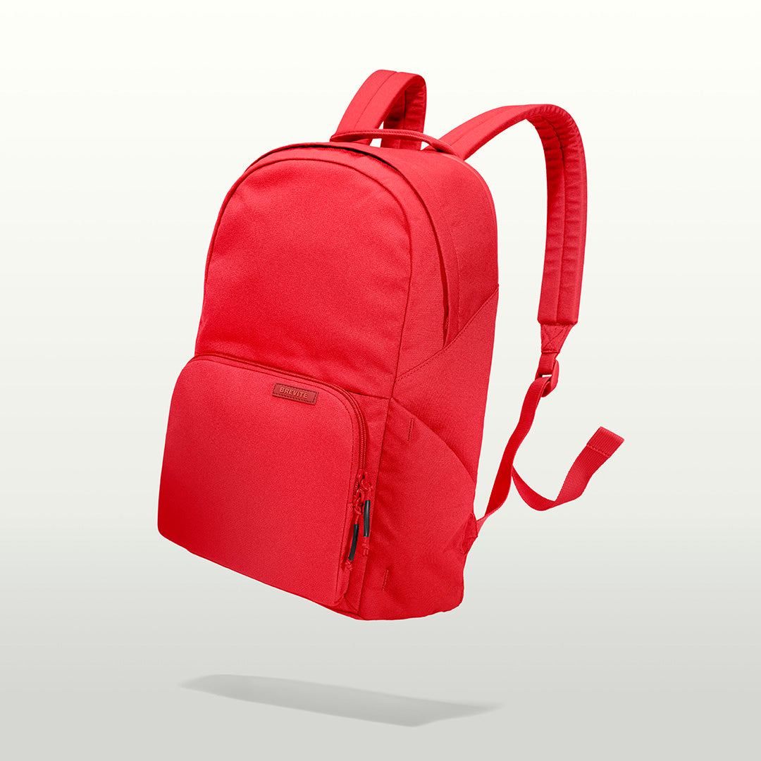 The Brevitē Backpack in Poppy Red, three-quarter view