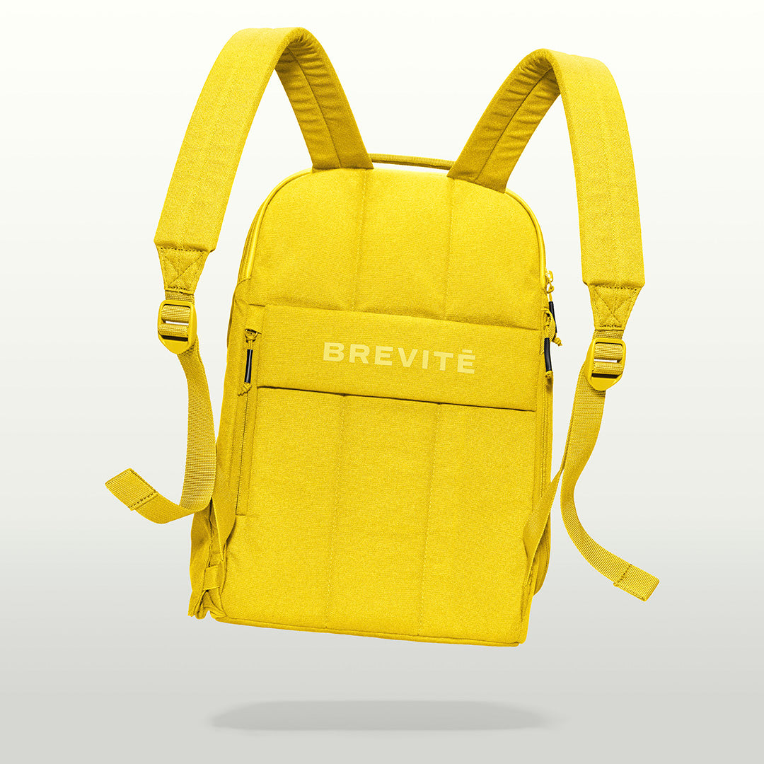 The Brevitē Backpack in Lemon Yellow, back panel and shoulder straps