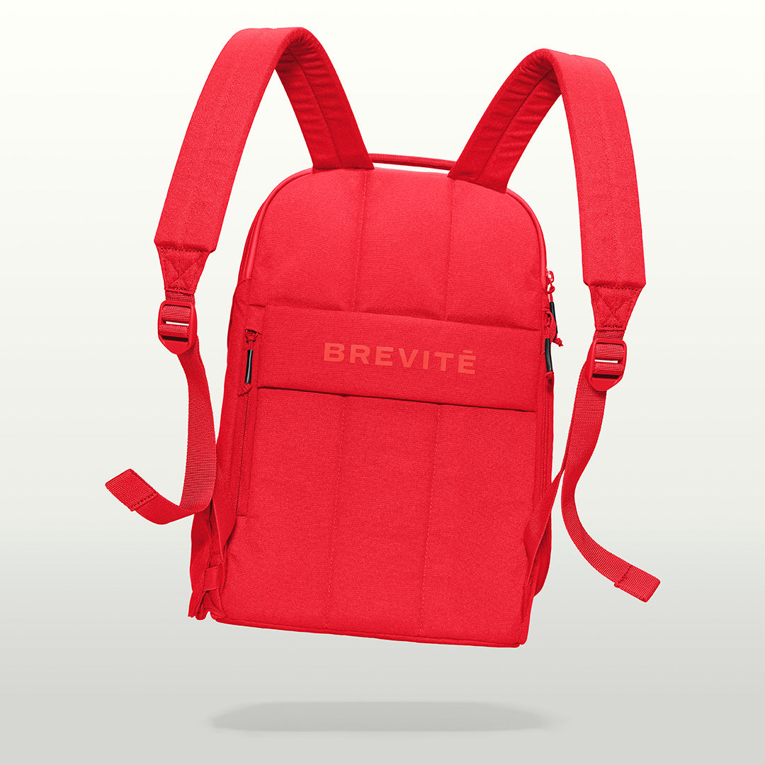 The Brevitē Backpack in Poppy Red, back panel and shoulder straps