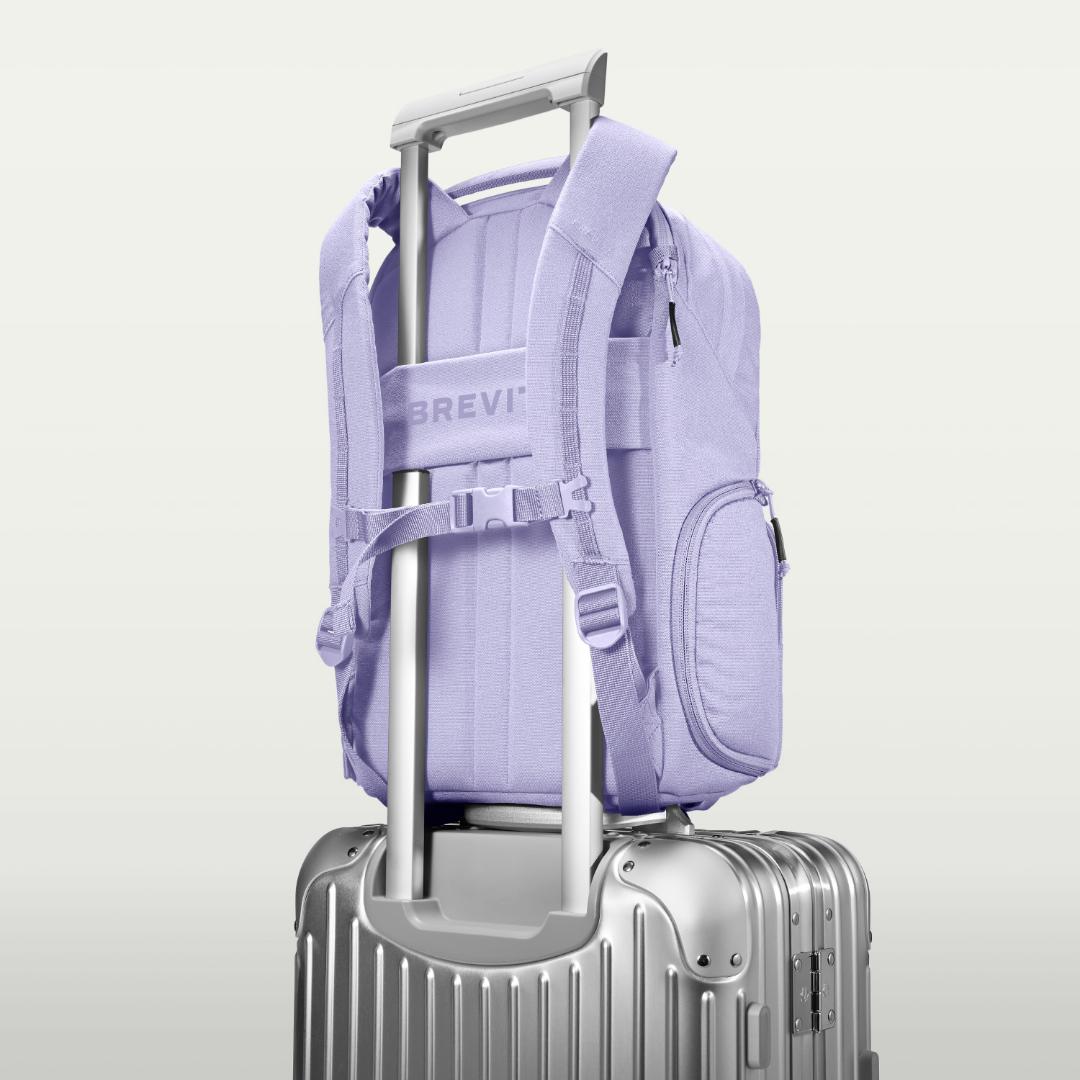 The Jumper in Lavender Dream, luggage strap over a suitcase handle