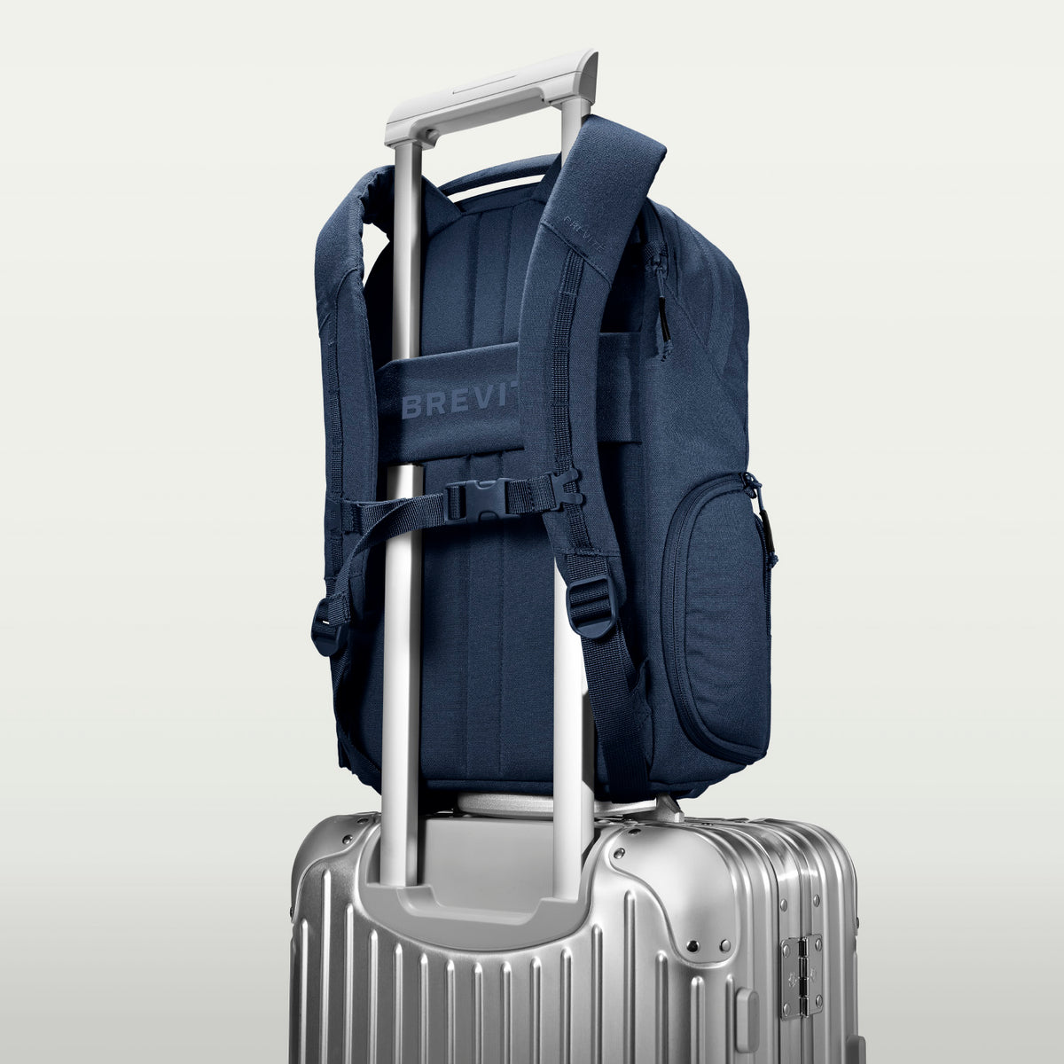 The Jumper in Moonlit Blue, luggage strap over a suitcase handle