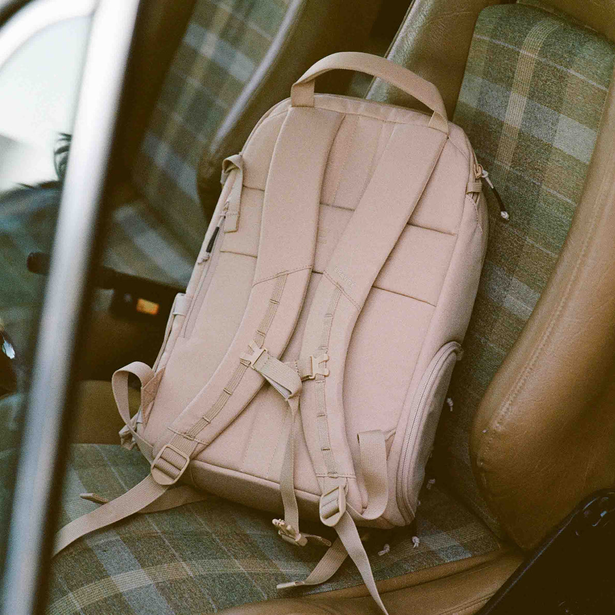 The Jumper in Desert Sand, on a car seat