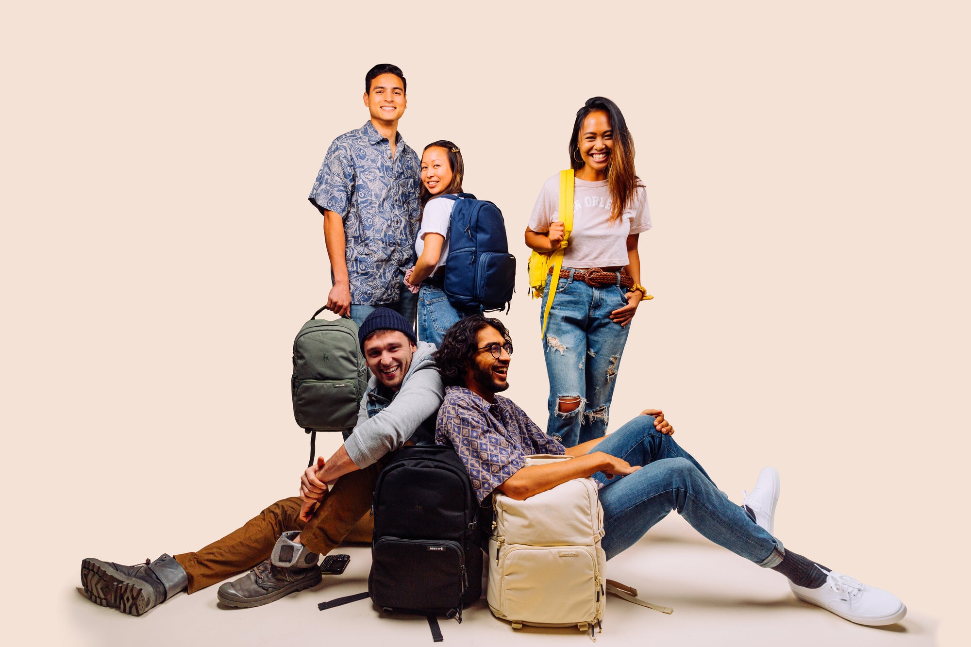 Group photo of models with backpacks